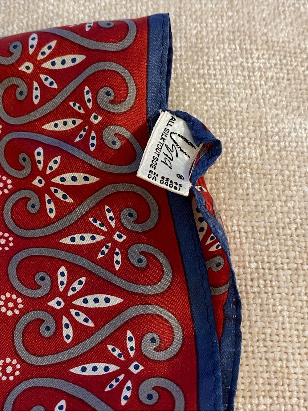 Vera Red silk scarf w/ grey accents & blue border. 11 x 52